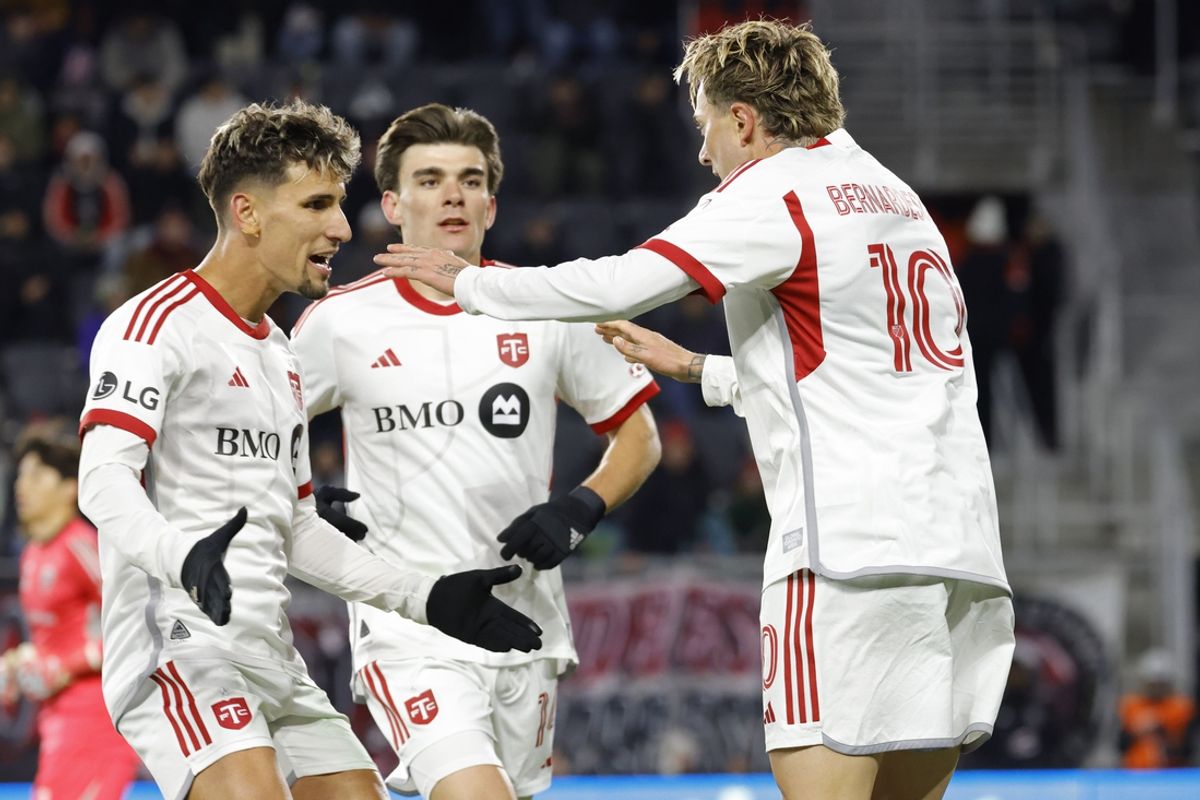 Feb 22, 2025; Washington, District of Columbia, USA; Toronto FC forward Federico Bernardeschi (10) celebrates with teammates after scoring a goal on a penalty kick against D.C. United goalkeeper Joon-Hong Kim (not pictured) during the second half at Audi Field. Mandatory Credit: Amber Searls-Imagn Images