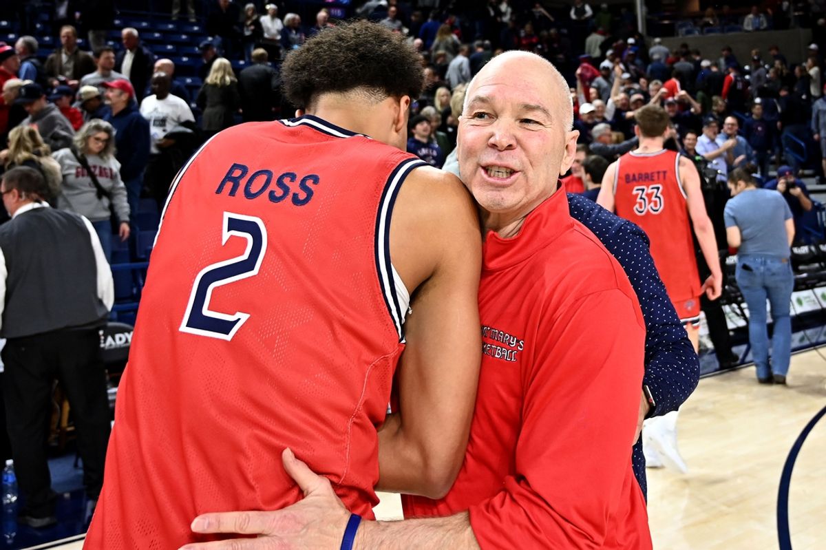 Feb 22, 2025; Spokane, Washington, USA; St. Mary's Gaels guard Jordan Ross (2) and St. Mary's Gaels head coach Randy Bennett celebrate after a game against the Gonzaga Bulldogs at McCarthey Athletic Center. Mandatory Credit: James Snook-Imagn Images