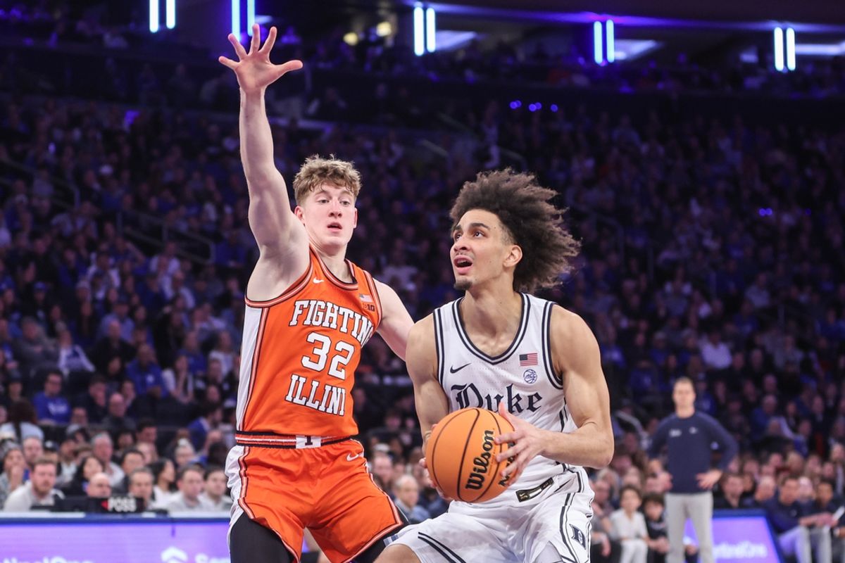 Feb 22, 2025; New York, NY, USA;  Duke Blue Devils guard Tyrese Proctor (5) looks to drive past Illinois Fighting Illini guard Kasparas Jakucionis (32) in the first half at Madison Square Garden. Mandatory Credit: Wendell Cruz-Imagn Images