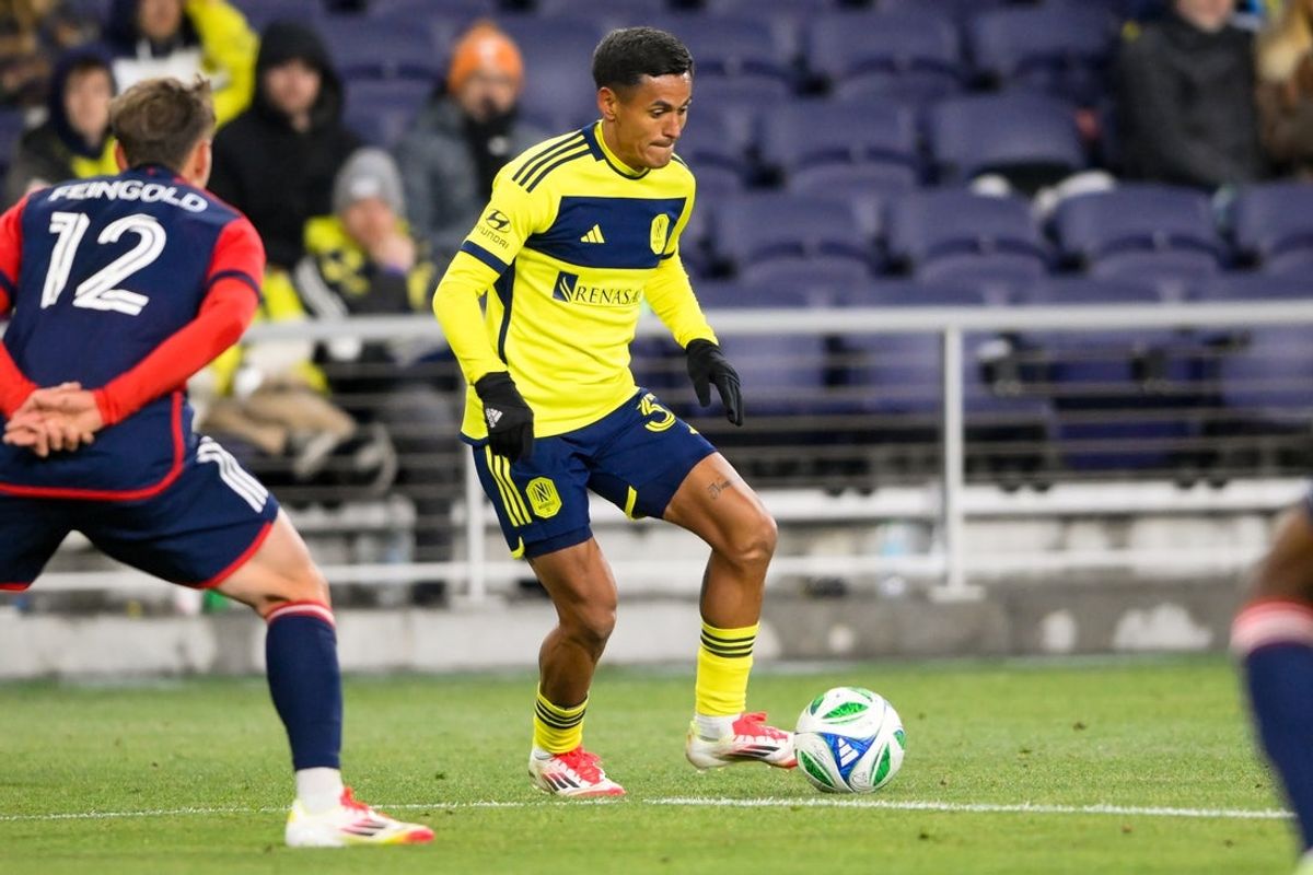 Feb 22, 2025; Nashville, Tennessee, USA;  Nashville SC midfielder Ahmed Qasem (37) dribbles the ball against the New England Revolution during the second half at Geodis Park. Mandatory Credit: Steve Roberts-Imagn Images
