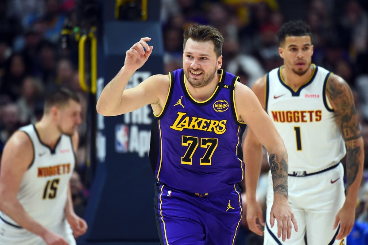 Feb 22, 2025; Denver, Colorado, USA; Los Angeles Lakers guard Luka Doncic (77) celebrates after a basket during the first half against the Denver Nuggets at Ball Arena. Mandatory Credit: Christopher Hanewinckel-Imagn Images
