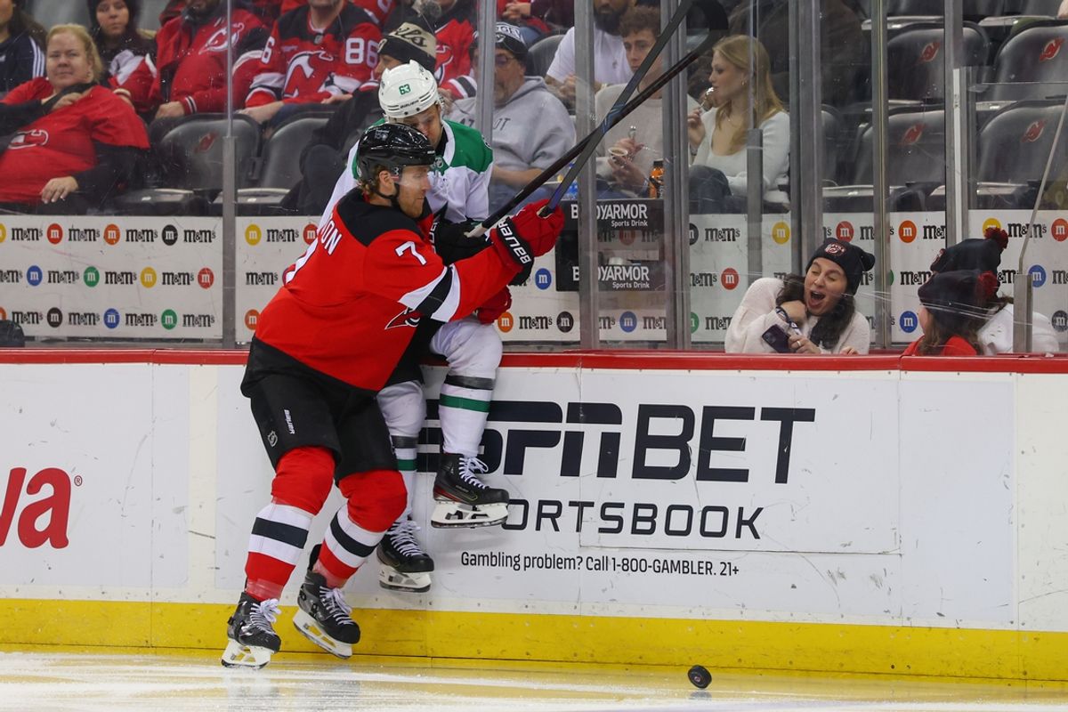 Feb 22, 2025; Newark, New Jersey, USA; New Jersey Devils defenseman Dougie Hamilton (7) hits Dallas Stars right wing Evgenii Dadonov (63) during the third period at Prudential Center. Mandatory Credit: Ed Mulholland-Imagn Images