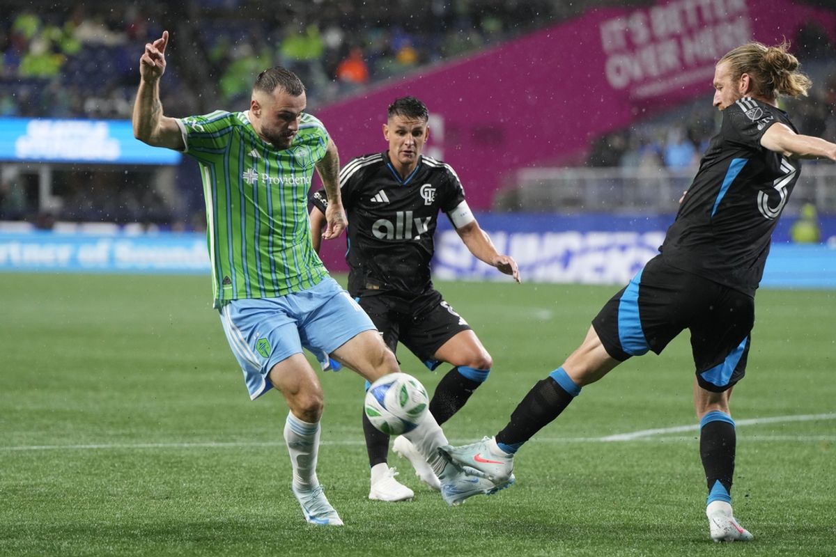 Feb 22, 2025; Seattle, Washington, USA; Seattle Sounders FC forward Jordan Morris (13) and Charlotte FC defender Tim Ream (3) battle for the ball in the second half at Lumen Field. Mandatory Credit: Stephen Brashear-Imagn Images