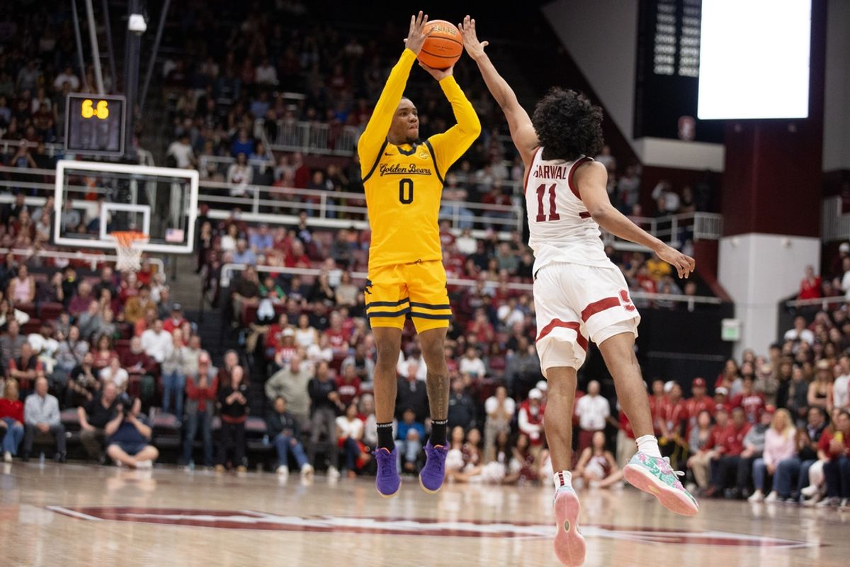 Feb 22, 2025; Stanford, California, USA; California Golden Bears guard Jeremiah Wilkinson (0) attempts a three-point basket over Stanford Cardinal guard Ryan Agarwal (11) in the closing seconds of the second half at Maples Pavilion. Mandatory Credit: D. Ross Cameron-Imagn Images