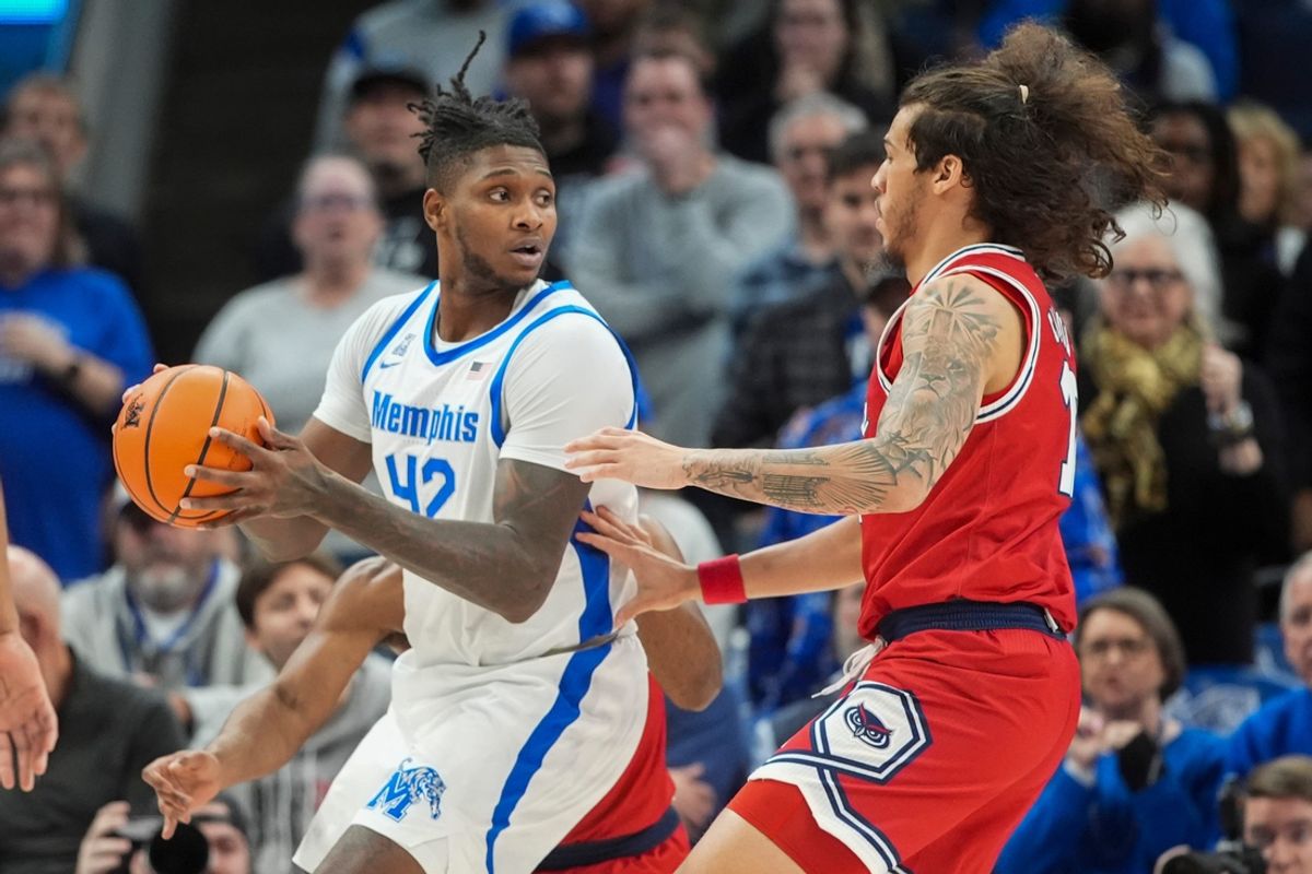 Memphis' Dain Dainja (42) looks to pass the ball during the game between Florida Atlantic University and the University of Memphis at FedExForum in Memphis, Tenn., on Sunday, February 23, 2025.