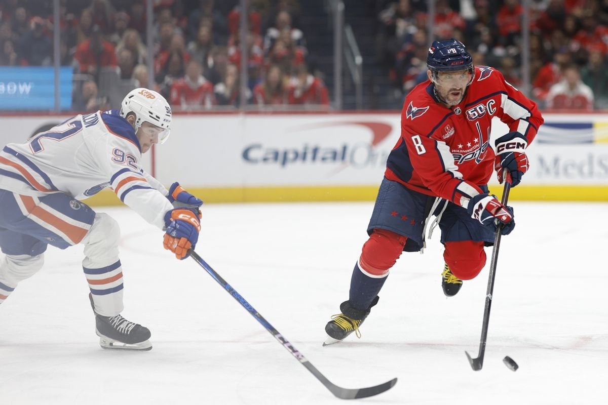 Feb 23, 2025; Washington, District of Columbia, USA; Washington Capitals left wing Alex Ovechkin (8) skates with the puck as Edmonton Oilers right wing Vasily Podkolzin (92) defends in the second period at Capital One Arena. Mandatory Credit: Geoff Burke-Imagn Images
