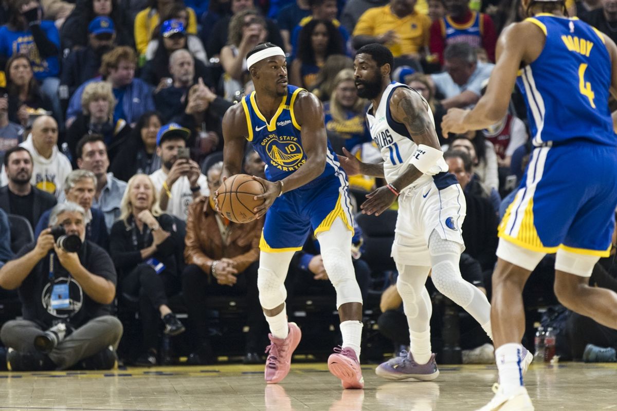 Feb 23, 2025; San Francisco, California, USA; Golden State Warriors forward Jimmy Butler III (10) looks to pass as Dallas Mavericks guard Kyrie Irving (11) defends during the first quarter at Chase Center. Mandatory Credit: John Hefti-Imagn Images