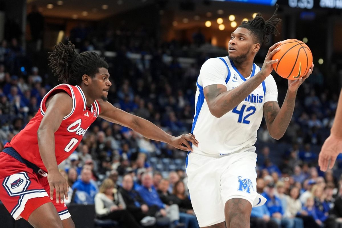 Memphis' Dain Dainja (42) drives to the basket during the game between Florida Atlantic University and the University of Memphis at FedExForum in Memphis, Tenn., on Sunday, February 23, 2025.