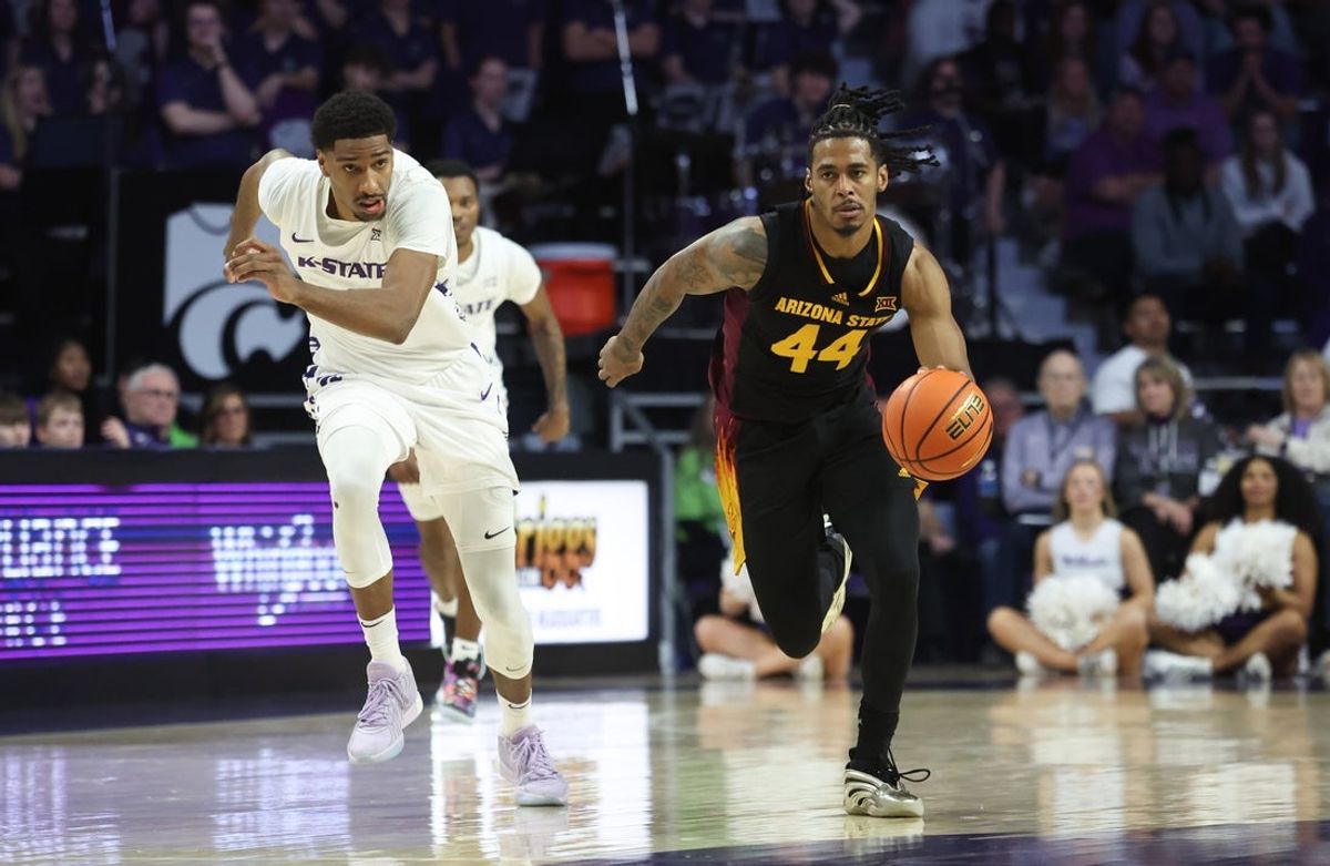 Feb 23, 2025; Manhattan, Kansas, USA; Arizona State Sun Devils guard Adam Miller (44) brings the ball up court against Kansas State Wildcats forward David N'Guessan (1) during the first half at Bramlage Coliseum. Mandatory Credit: Scott Sewell-Imagn Images