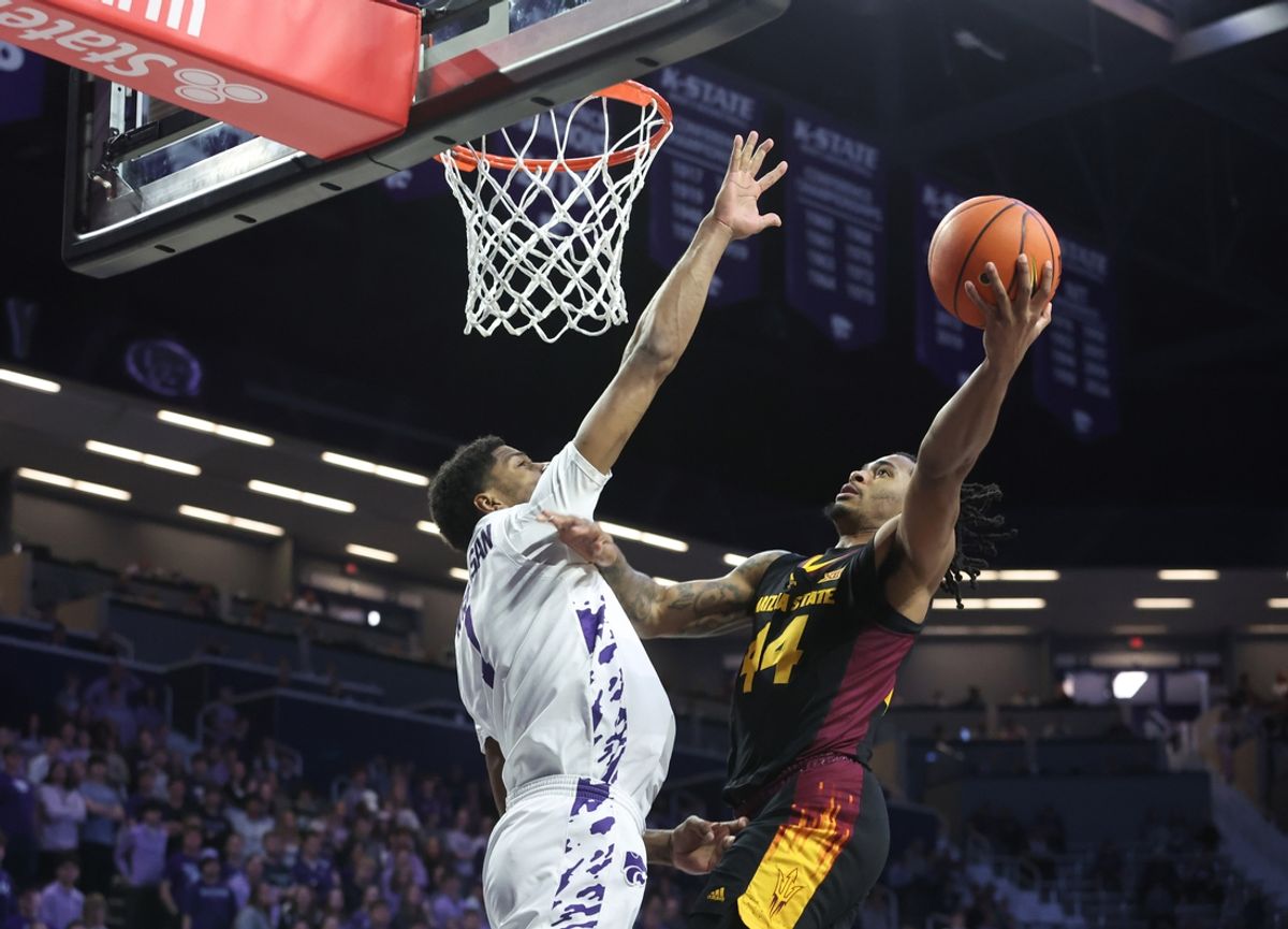 Feb 23, 2025; Manhattan, Kansas, USA; Arizona State Sun Devils guard Adam Miller (44) shoots against Kansas State Wildcats forward David N'Guessan (1) during the first half  at Bramlage Coliseum. Mandatory Credit: Scott Sewell-Imagn Images