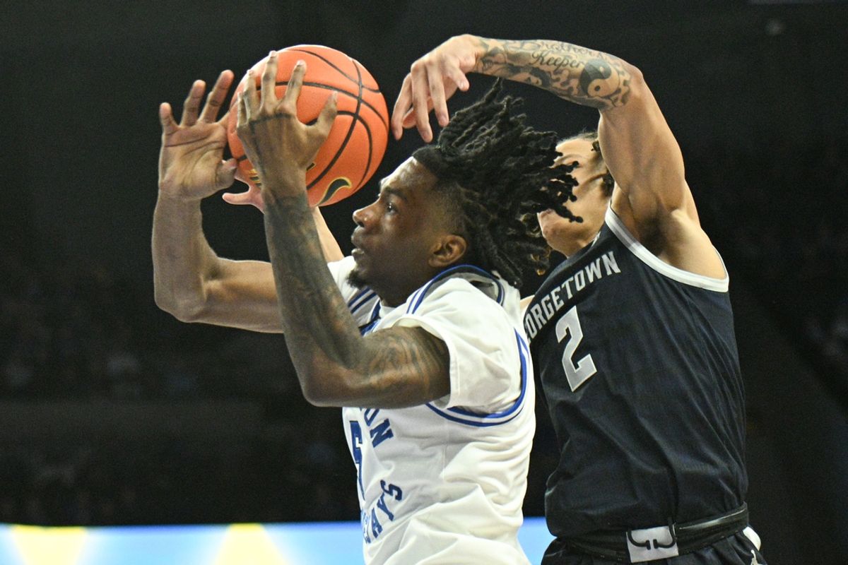 Feb 23, 2025; Omaha, Nebraska, USA;  Georgetown Hoyas guard Malik Mack (2) fouls Creighton Bluejays guard Jamiya Neal (5) during the second half at CHI Health Center Omaha. Mandatory Credit: Steven Branscombe-Imagn Images
