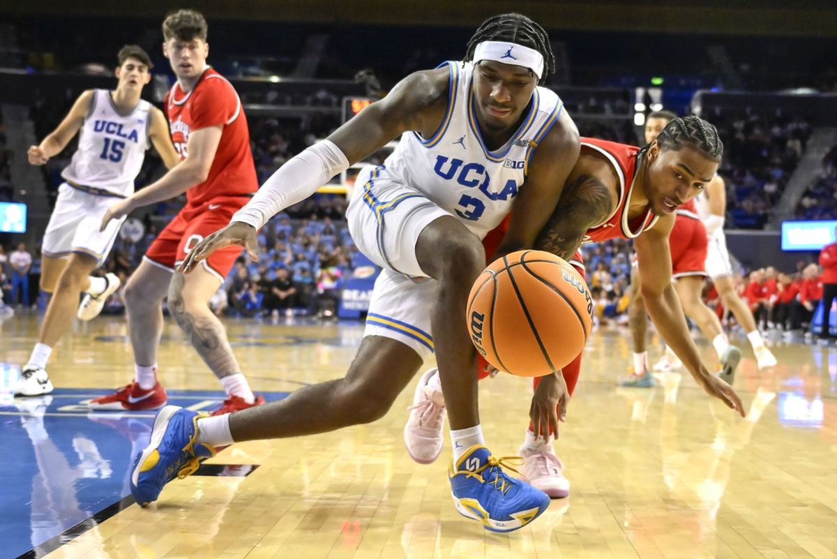 Feb 23, 2025; Los Angeles, California, USA; UCLA Bruins guard Eric Dailey Jr. (3) and Ohio State Buckeyes guard Ques Glover (6) chase a loose ball during the second half at Pauley Pavilion presented by Wescom. Mandatory Credit: Robert Hanashiro-Imagn Images