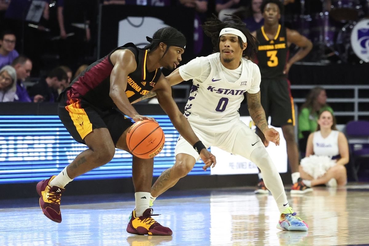 Feb 23, 2025; Manhattan, Kansas, USA; Arizona State Sun Devils guard Alston Mason (1) is guarded by Kansas State Wildcats guard Dug McDaniel (0) during the second half at Bramlage Coliseum. Mandatory Credit: Scott Sewell-Imagn Images
