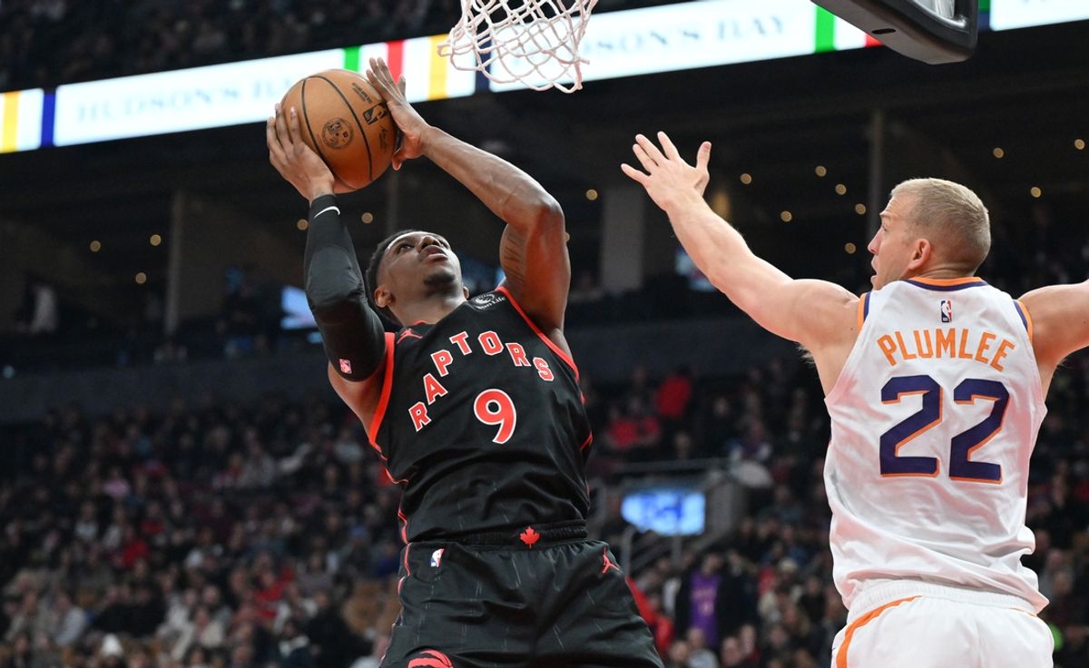 Feb 23, 2025; Toronto, Ontario, CAN;  Toronto Raptors forward RJ Barrett (9) shoots the ball as Phoenix Suns center Mason Plumlee (22) defends in the first half at Scotiabank Arena. Mandatory Credit: Dan Hamilton-Imagn Images