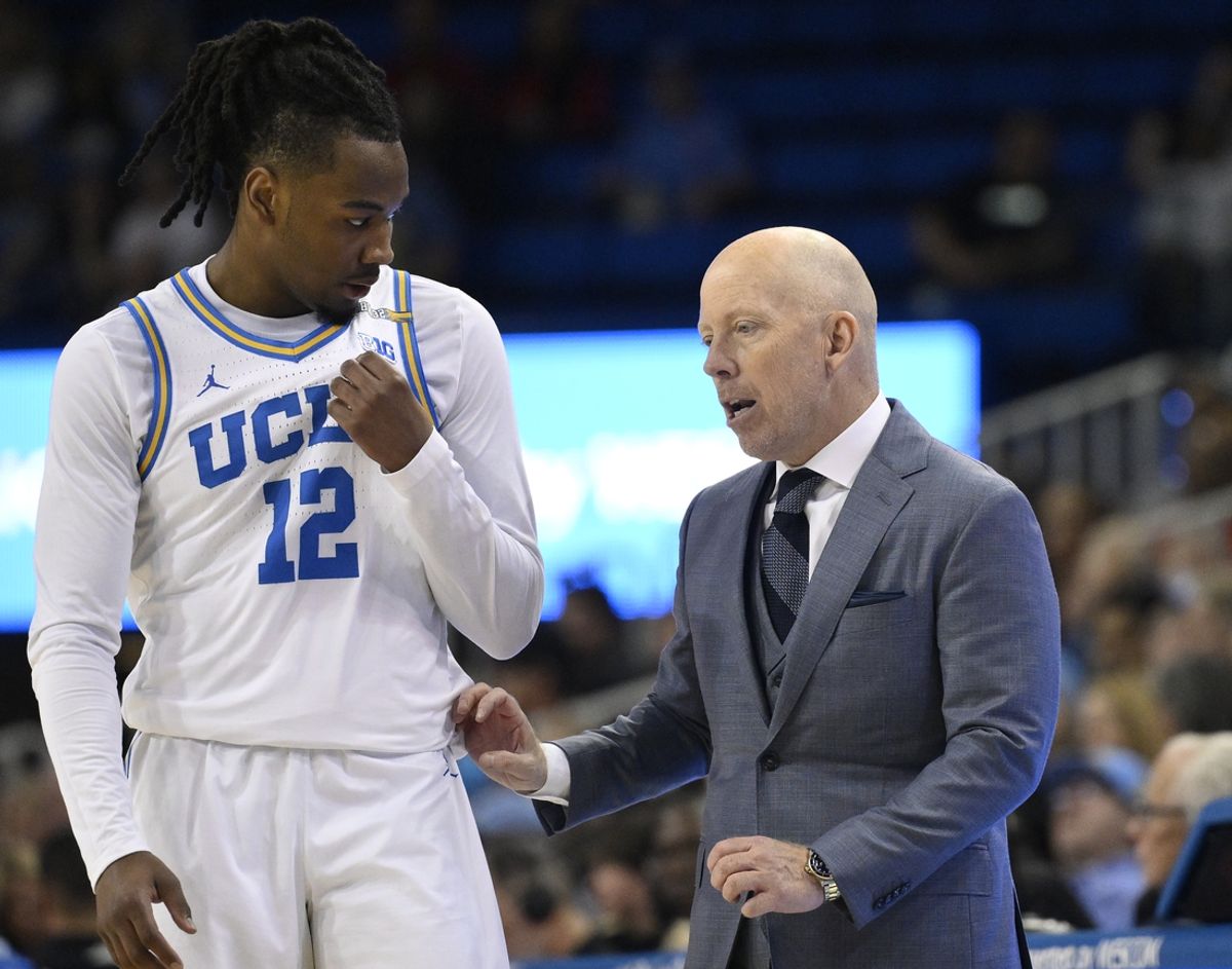 Feb 23, 2025; Los Angeles, California, USA; UCLA Bruins head coach Mick Cronin talks to UCLA Bruins guard Sebastian Mack (12) during the second half at Pauley Pavilion presented by Wescom. Mandatory Credit: Robert Hanashiro-Imagn Images
