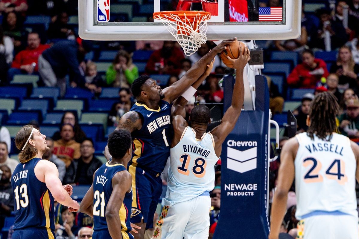 Feb 23, 2025; New Orleans, Louisiana, USA;  New Orleans Pelicans forward Zion Williamson (1) blocks the shot San Antonio Spurs center Bismack Biyombo (18) during the first half at Smoothie King Center. Mandatory Credit: Stephen Lew-Imagn Images