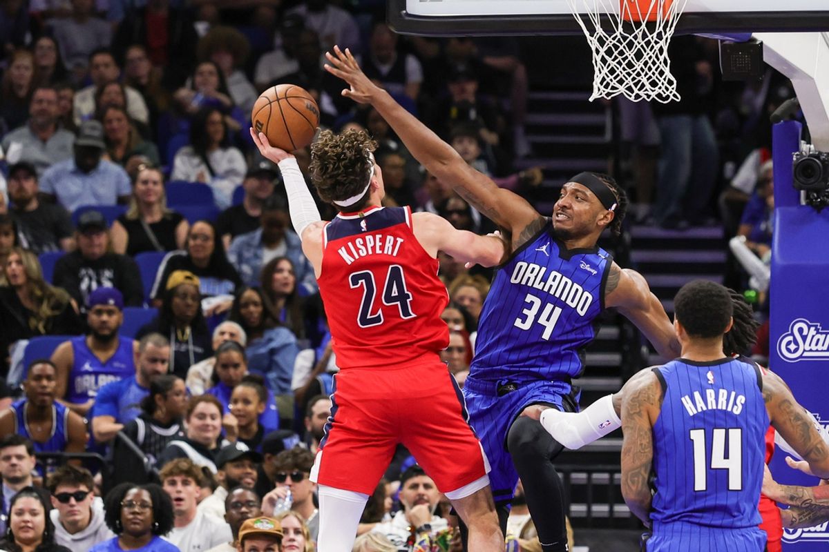 Feb 23, 2025; Orlando, Florida, USA; Washington Wizards forward Corey Kispert (24) goes to the basket against Orlando Magic center Wendell Carter Jr. (34) during the second half at Kia Center. Mandatory Credit: Mike Watters-Imagn Images