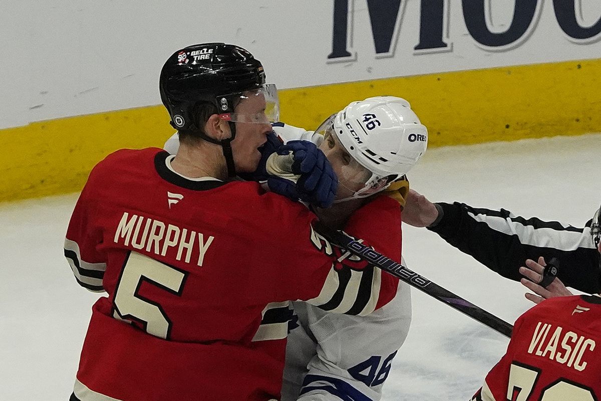 Feb 23, 2025; Chicago, Illinois, USA; Chicago Blackhawks defenseman Connor Murphy (5) and Toronto Maple Leafs center Alex Steeves (46) shove each other during the second period at United Center. Mandatory Credit: David Banks-Imagn Images