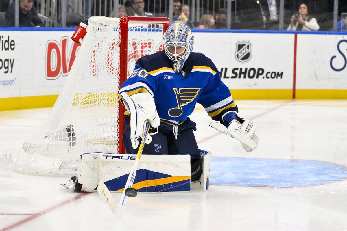 Feb 23, 2025; St. Louis, Missouri, USA;  St. Louis Blues goaltender Jordan Binnington (50) defends the net against the Colorado Avalanche during the third period at Enterprise Center. Mandatory Credit: Jeff Curry-Imagn Images