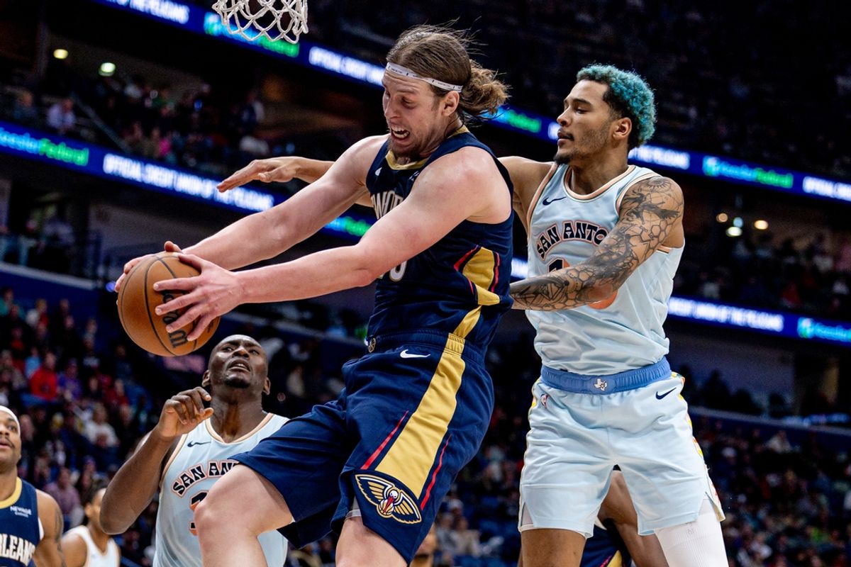Feb 23, 2025; New Orleans, Louisiana, USA;  San Antonio Spurs forward Jeremy Sochan (10) and New Orleans Pelicans forward Kelly Olynyk (13) fight for position during the second half at Smoothie King Center. Mandatory Credit: Stephen Lew-Imagn Images