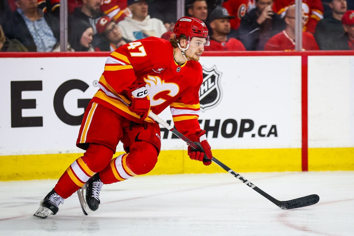 Feb 23, 2025; Calgary, Alberta, CAN; Calgary Flames center Connor Zary (47) skates against the San Jose Sharks during the third period at Scotiabank Saddledome. Mandatory Credit: Sergei Belski-Imagn Images