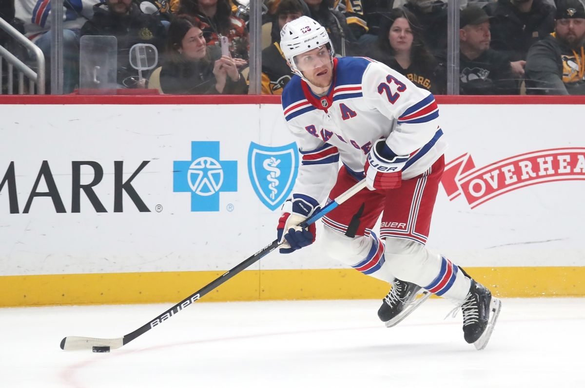 Feb 23, 2025; Pittsburgh, Pennsylvania, USA;  New York Rangers defenseman Adam Fox (23) handles the puck against the Pittsburgh Penguins during the first period at PPG Paints Arena. Mandatory Credit: Charles LeClaire-Imagn Images