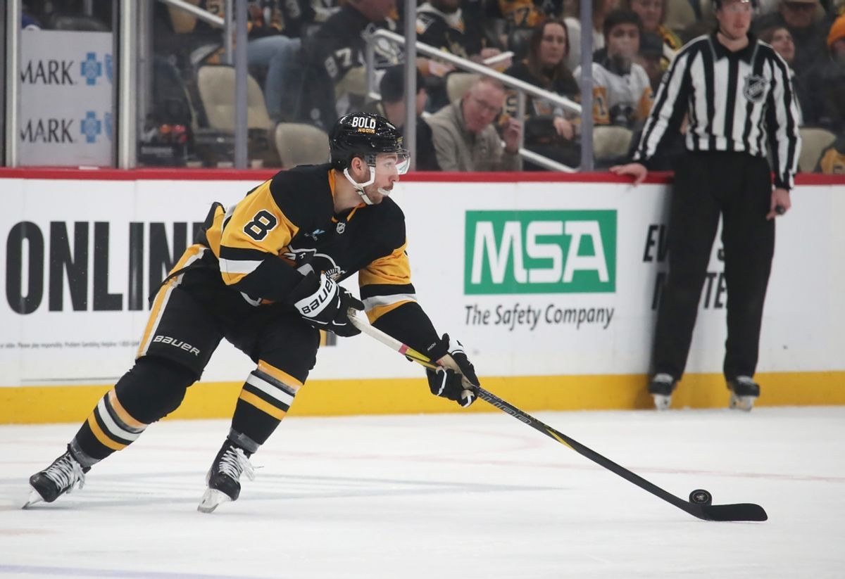 Feb 23, 2025; Pittsburgh, Pennsylvania, USA;  Pittsburgh Penguins left wing Michael Bunting (8) moves the puck against the New York Rangers during the second period at PPG Paints Arena. Mandatory Credit: Charles LeClaire-Imagn Images