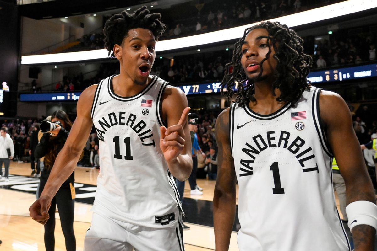 Feb 22, 2025; Nashville, Tennessee, USA;  Vanderbilt Commodores guard AJ Hoggard (11) and guard Jason Edwards (1) celebrate the win over against the Mississippi Rebels during the second half at Memorial Gymnasium. Mandatory Credit: Steve Roberts-Imagn Images