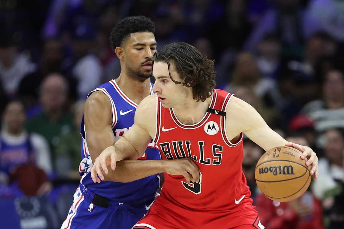 Feb 24, 2025; Philadelphia, Pennsylvania, USA; Chicago Bulls guard Josh Giddey (3) controls the ball against Philadelphia 76ers guard Quentin Grimes (5) during the first quarter at Wells Fargo Center. Mandatory Credit: Bill Streicher-Imagn Images