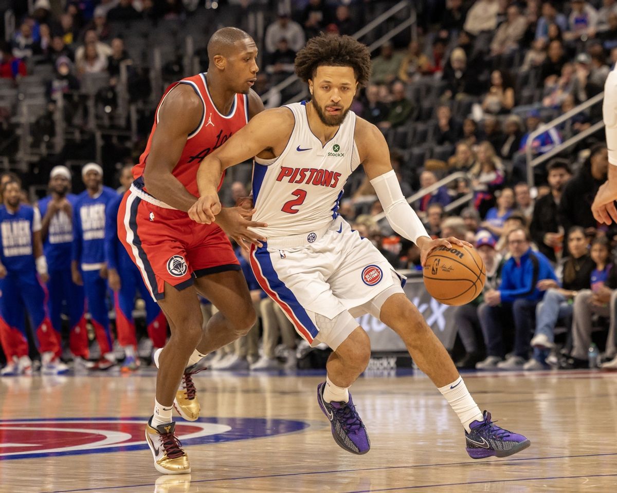 Feb 24, 2025; Detroit, Michigan, USA; Detroit Pistons guard Cade Cunningham (2) controls the ball in front of LA Clippers guard Kris Dunn (8) during the first half at Little Caesars Arena. Mandatory Credit: David Reginek-Imagn Images