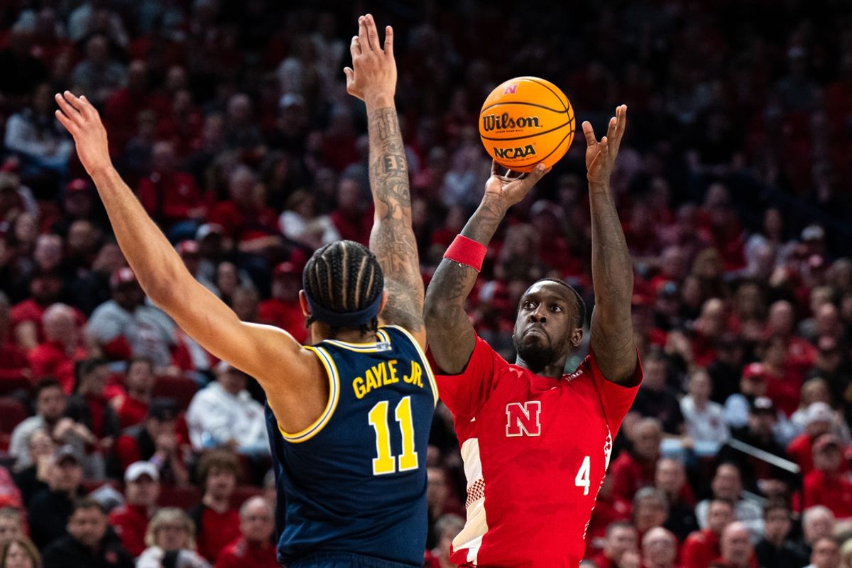 Feb 24, 2025; Lincoln, Nebraska, USA; Nebraska Cornhuskers forward Juwan Gary (4) shoots the ball against Michigan Wolverines guard Roddy Gayle Jr. (11) during the first half at Pinnacle Bank Arena. Mandatory Credit: Dylan Widger-Imagn Images