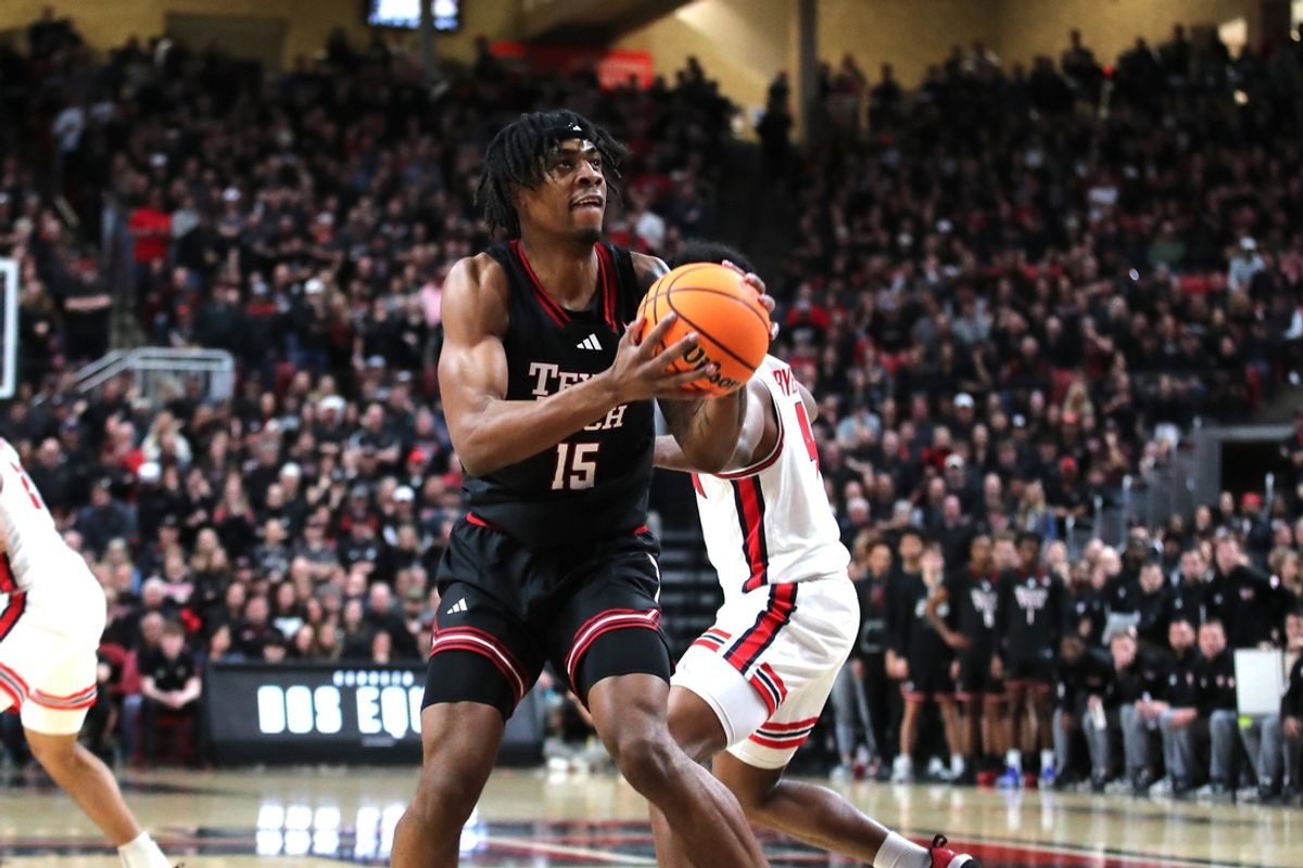 Feb 24, 2025; Lubbock, Texas, USA; Texas Tech Red Raiders forward JT Toppin (15) stops to shoot against Houston Cougars guard LJ Cryer (4) in the first half at United Supermarkets Arena. Mandatory Credit: Michael C. Johnson-Imagn Images