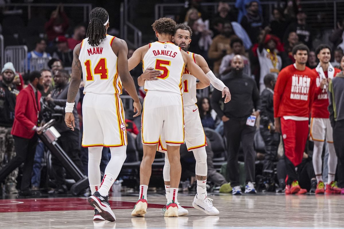 Feb 24, 2025; Atlanta, Georgia, USA; Atlanta Hawks guards Trae Young (11) and Dyson Daniels (5) react after the Hawks defeated the Miami Heat at State Farm Arena. Mandatory Credit: Dale Zanine-Imagn Images