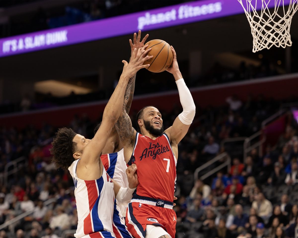 Feb 24, 2025; Detroit, Michigan, USA; Detroit Pistons guard Cade Cunningham (2) defends against LA Clippers guard Amir Coffey (7) during the second half at Little Caesars Arena. Mandatory Credit: David Reginek-Imagn Images
