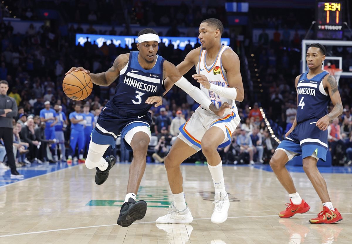Feb 24, 2025; Oklahoma City, Oklahoma, USA; Minnesota Timberwolves forward Jaden McDaniels (3) drives down the court around Oklahoma City Thunder guard Aaron Wiggins (21) during overtime at Paycom Center. Mandatory Credit: Alonzo Adams-Imagn Images