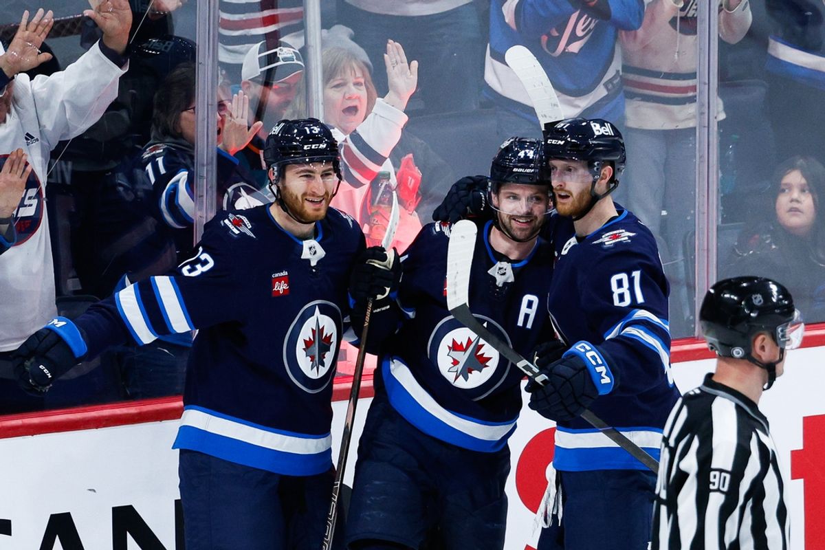 Feb 24, 2025; Winnipeg, Manitoba, CAN;  Winnipeg Jets defenseman Josh Morrissey (44) is congratulated by his team mates on his goal against the San Jose Sharks during the third period at Canada Life Centre. Mandatory Credit: Terrence Lee-Imagn Images