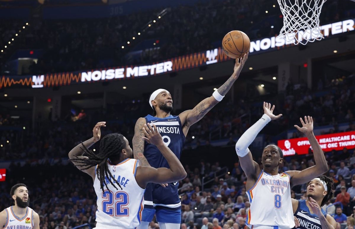 Feb 24, 2025; Oklahoma City, Oklahoma, USA; Minnesota Timberwolves guard Nickeil Alexander-Walker (9) goes up for a basket between Oklahoma City Thunder guard Cason Wallace (22) and forward Jalen Williams (8) during the second half at Paycom Center. Mandatory Credit: Alonzo Adams-Imagn Images