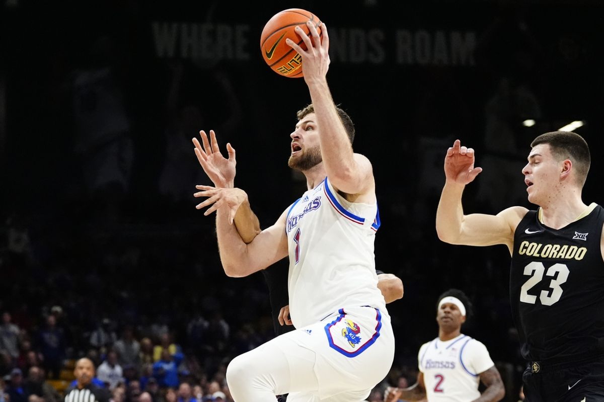 Feb 24, 2025; Boulder, Colorado, USA; Kansas Jayhawks center Hunter Dickinson (1) is fouled by Colorado Buffaloes guard Julian Hammond III (3) in the first half at the CU Events Center. Mandatory Credit: Ron Chenoy-Imagn Images