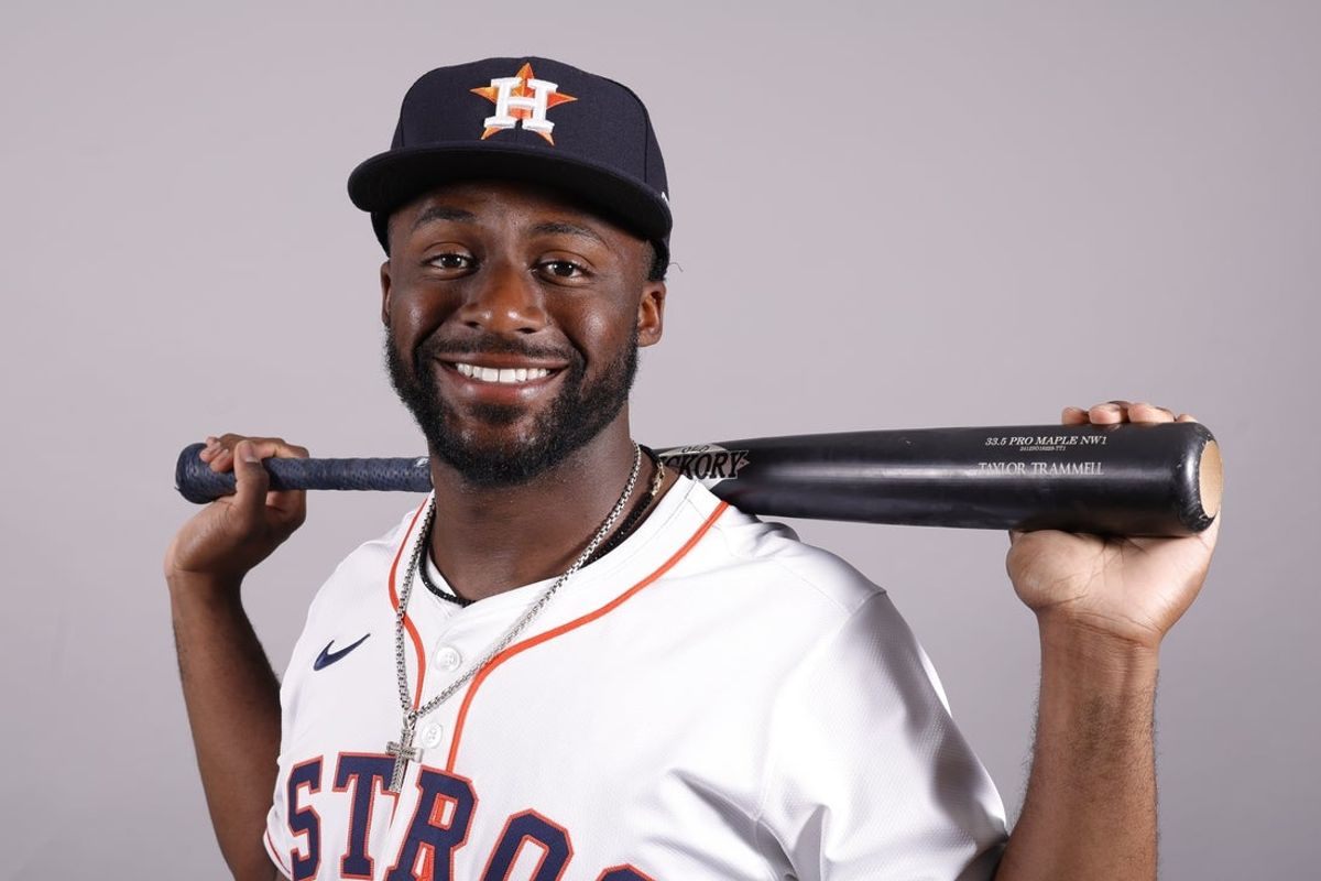 Feb 20, 2025; West Palm Beach, FL, USA;  Houston Astros outfielder Taylor Trammell (26) poses for a photo at the Houston Astros media day. Mandatory Credit: Reinhold Matay-Imagn Images