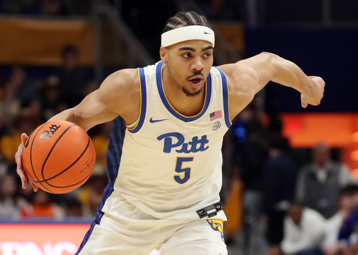 Feb 25, 2025; Pittsburgh, Pennsylvania, USA;  Pittsburgh Panthers guard Ishmael Leggett (5) dribbles against the Georgia Tech Yellow Jackets during the first half at the Petersen Events Center. Mandatory Credit: Charles LeClaire-Imagn Images