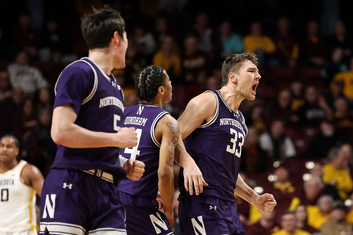 Feb 25, 2025; Minneapolis, Minnesota, USA; Northwestern Wildcats forward Luke Hunger (33) celebrates his basket against the Minnesota Golden Gophers during the first half at Williams Arena. Mandatory Credit: Matt Krohn-Imagn Images