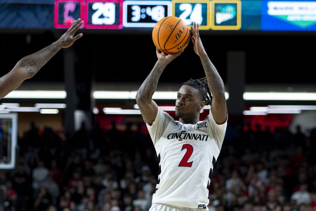 Feb 25, 2025; Cincinnati, Ohio, USA;  Cincinnati Bearcats guard Jizzle James (2) attempts a three-point shot against the Baylor Bears in the first half at Fifth Third Arena. Mandatory Credit: Aaron Doster-Imagn Images