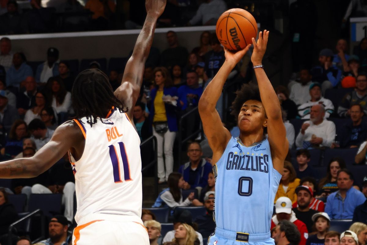 Feb 25, 2025; Memphis, Tennessee, USA; Memphis Grizzlies forward Jaylen Wells (0) shoots for three as Phoenix Suns center Bol Bol (11) defends during the first quarter at FedExForum. Mandatory Credit: Petre Thomas-Imagn Images