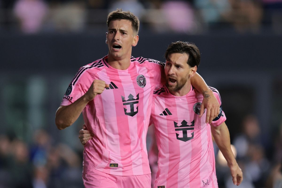 Feb 25, 2025; Fort Lauderdale, Florida, USA;Inter Miami CF forward Tadeo Allende (21) celebrates with forward Lionel Messi (10) after scoring against Sporting Kansas City during the first half in Round One of the 2025 Concacaf Champions Cup at Chase Stadium. Mandatory Credit: Sam Navarro-Imagn Images