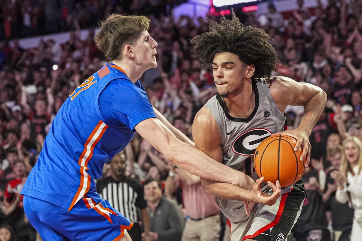 Feb 25, 2025; Athens, Georgia, USA; Georgia Bulldogs forward Asa Newell (14) gets fouled by Florida Gators forward Alex Condon (21) late in the game during the second half at Stegeman Coliseum. Mandatory Credit: Dale Zanine-Imagn Images