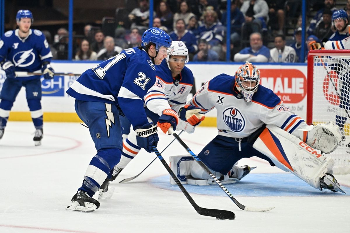 Feb 25, 2025; Tampa, Florida, USA; Tampa Bay Lightning center Brayden Point (21) takes a shot on goal  in the third period against the Edmonton Oilers at Amalie Arena. Mandatory Credit: Jonathan Dyer-Imagn Images