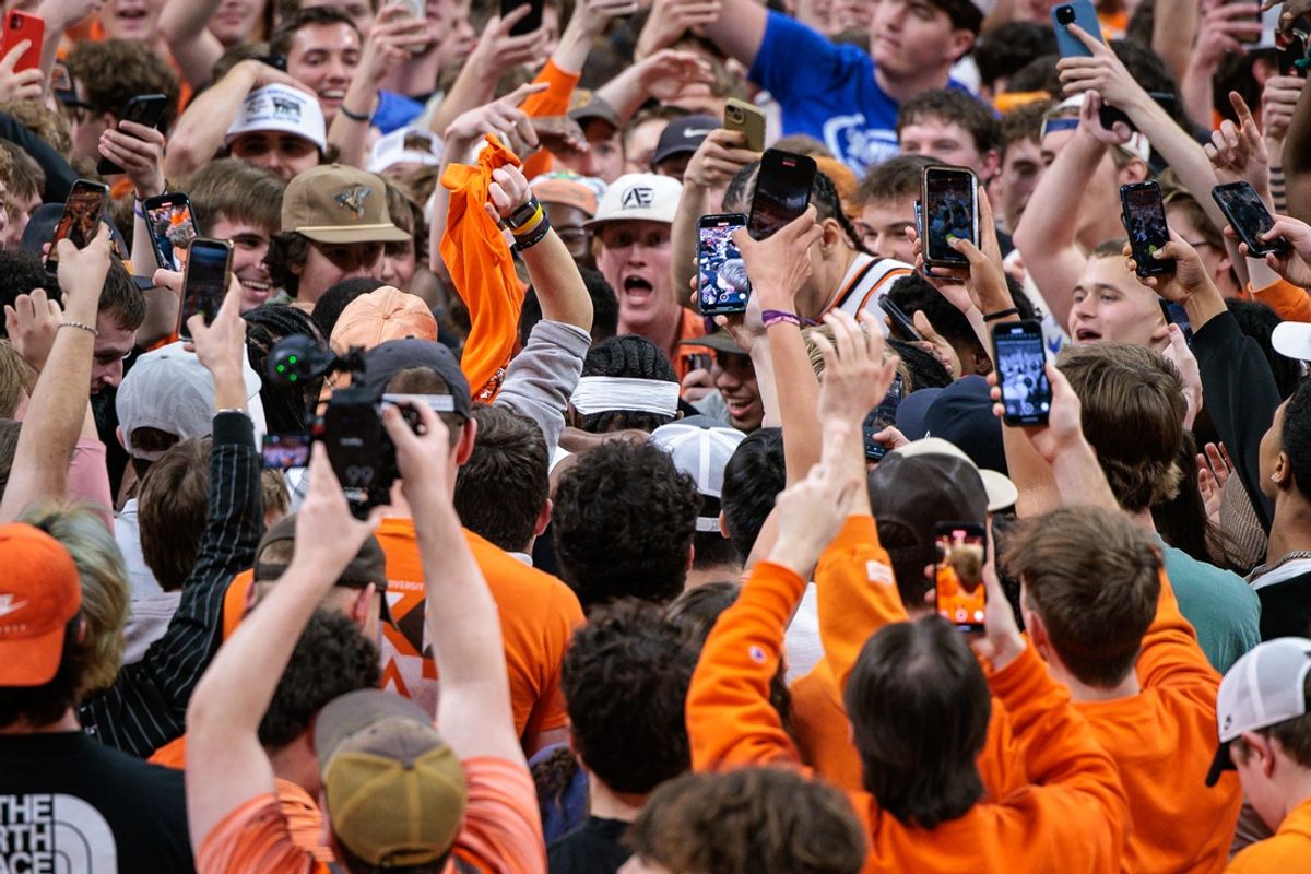 Feb 25, 2025; Stillwater, Oklahoma, USA; Oklahoma State Cowboys fans storm the court to celebrate after the game against the Iowa State Cyclones at Gallagher-Iba Arena. Mandatory Credit: William Purnell-Imagn Images