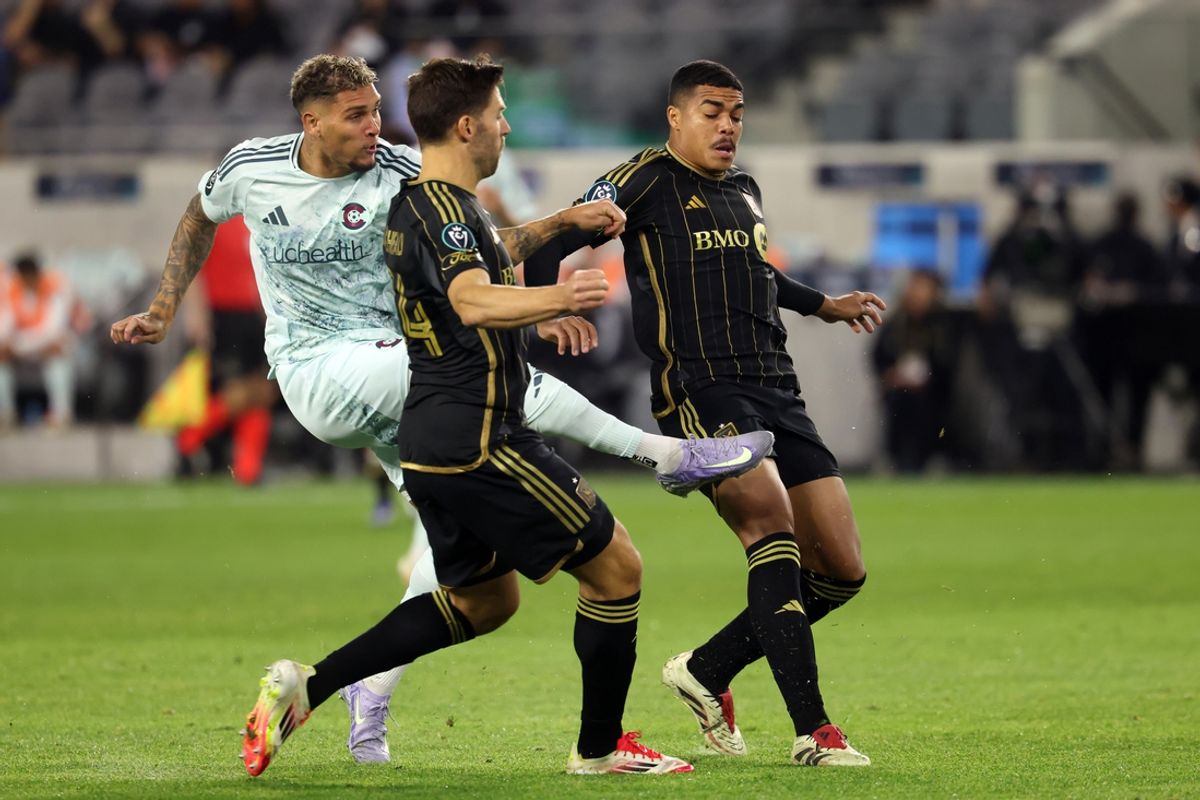 Feb 25, 2025; Los Angeles, California, USA;  Colorado Rapids forward Rafael Navarro (9) shoots the ball between LAFC midfielder Ryan Hollingshead (24) and midfielder Igor Jesus (6) during the first half of Concacaf Champions Cup Round 1 match at BMO Stadium. Mandatory Credit: Kiyoshi Mio-Imagn Images