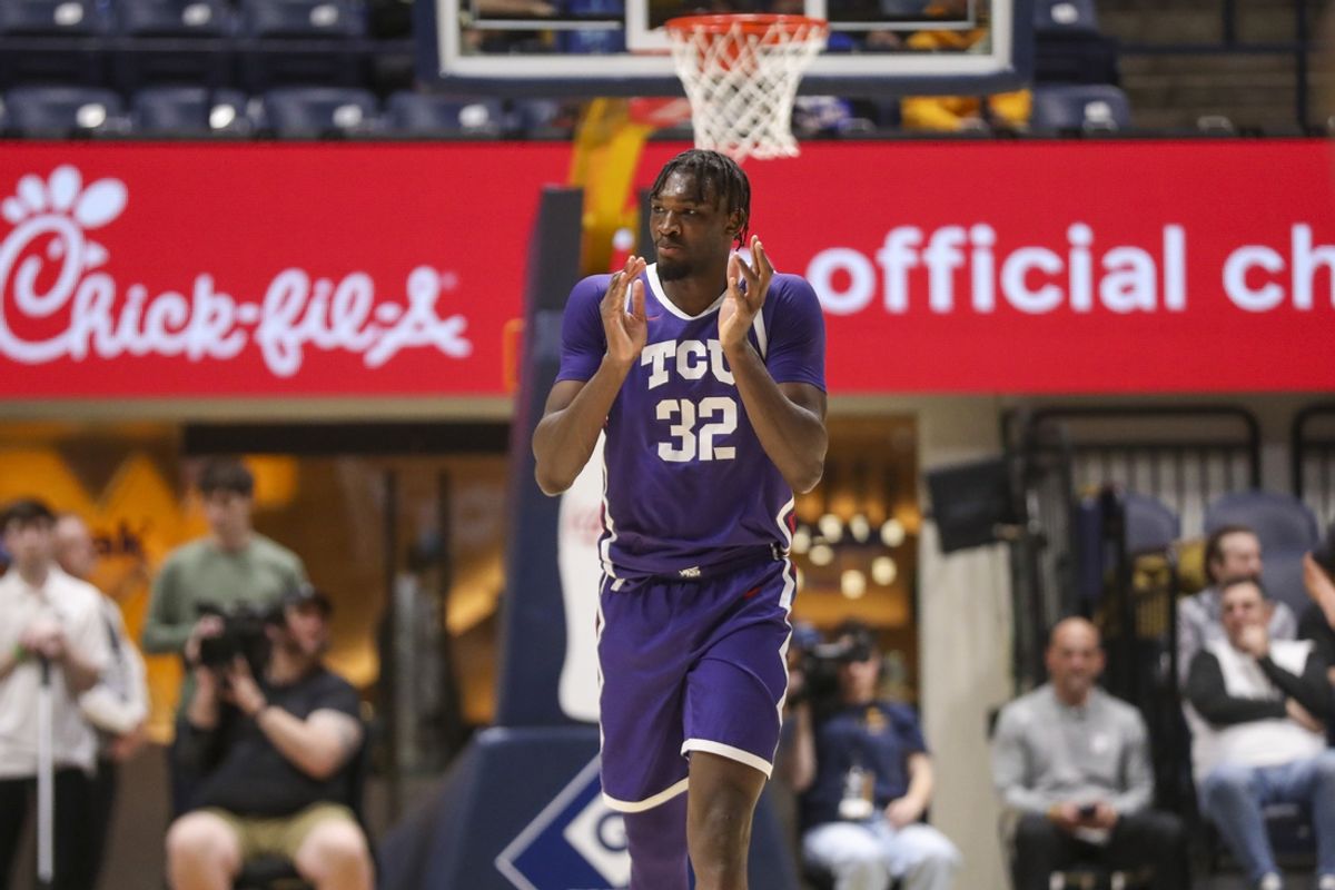 Feb 25, 2025; Morgantown, West Virginia, USA; TCU Horned Frogs center Malick Diallo (32) celebrates after a play during the second half against the West Virginia Mountaineers at WVU Coliseum. Mandatory Credit: Ben Queen-Imagn Images