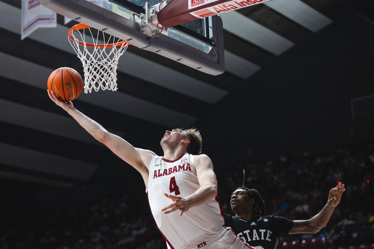 Feb 25, 2025; Tuscaloosa, Alabama, USA; Alabama Crimson Tide forward Grant Nelson (4) shoots against Mississippi State Bulldogs forward KeShawn Murphy (3) during the second half at Coleman Coliseum. Mandatory Credit: Will McLelland-Imagn Images